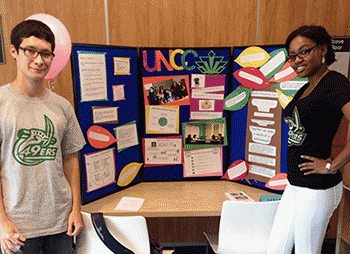 Students Travis and Tenielle with a display board